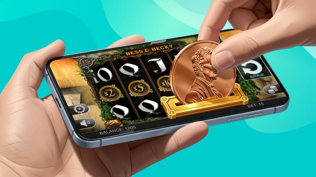 On a teal background, a hand inserts a heads-up penny into a coin slot on a smartphone, while the phone displays the penny slot ‘Bess and Becky’.