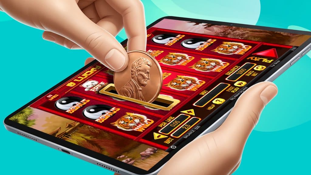 The penny slot ‘8 Lucky Charms’ is playing on a tablet, with a pointer finger and thumb directing a penny into a coin slot to operate the game.