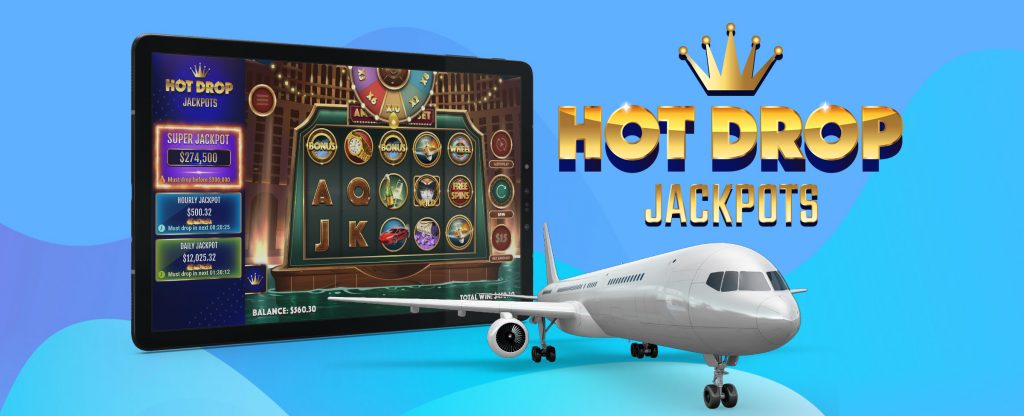 Jumbo jet animasi 3D sedang duduk di jalur taksi abstrak biru, di depan iPad yang menampilkan gameplay dari game slot SlotsLV American Jet Set Hot Drop Jackpots, menampilkan logo game yang sama di atas jet.