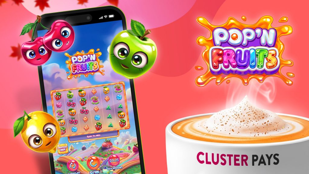 Red, yellow, and green cartoon fruits surround a smartphone playing a slot game called “Pop’n Fruits.” We see the name of the game above the hot steam rising from a white mug that says, “Cluster Pays” on a red background.