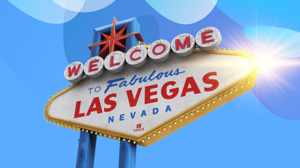 The famous “Welcome to Fabulous Las Vegas, Nevada” sign is shown over a light blue background with a shining sun on the top right.